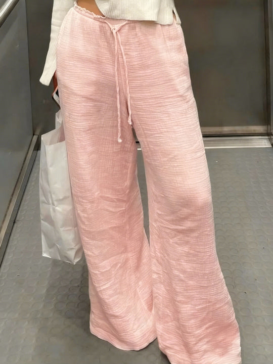Damen Leinenhose mit lockerer, knöchellanger Passform, seitlichen Eingrifftaschen und Zierknopf-Details Shop Nory
