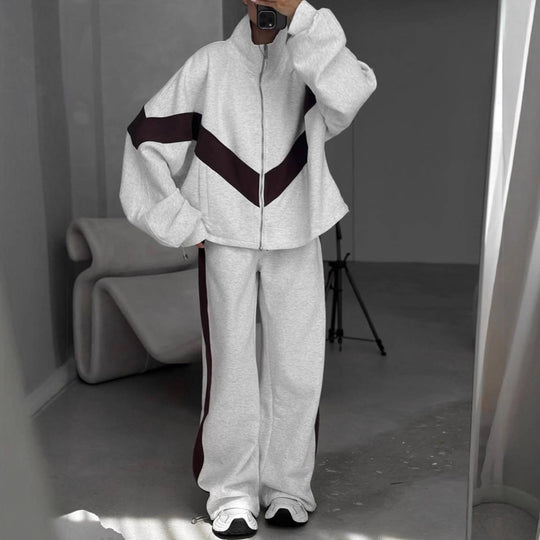 Damen eleganter sportlicher Zweiteiler Trainingsanzug mit Reißverschluss und kontrastierender V-Passe Shop Nory