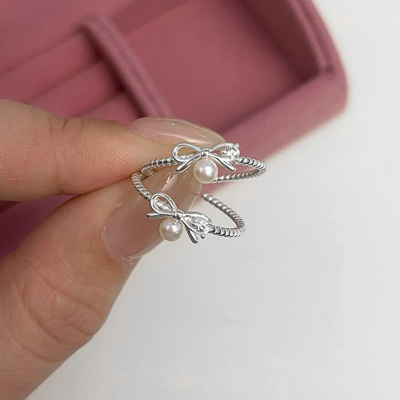Damen Ring mit elegantem Schleifen- und Perlenmotiv Shop Nory