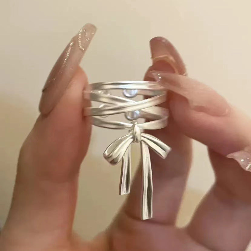 Damen Offener Ring mit kunstvollem Banddesign und elegantem Schleifenmotiv Shop Nory