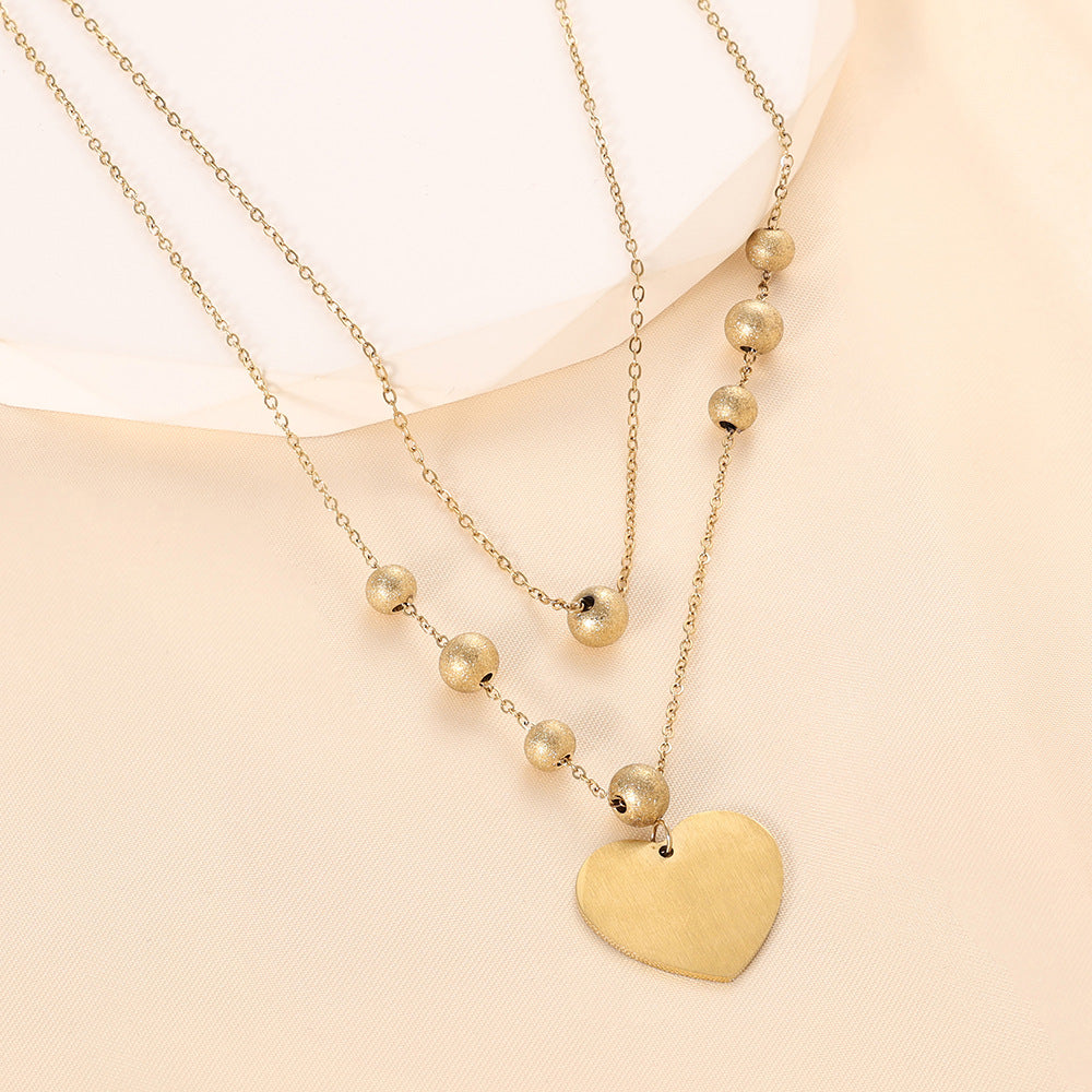 Damen Halskette mit herzförmigem Anhänger und eleganten Perlen Shop Nory