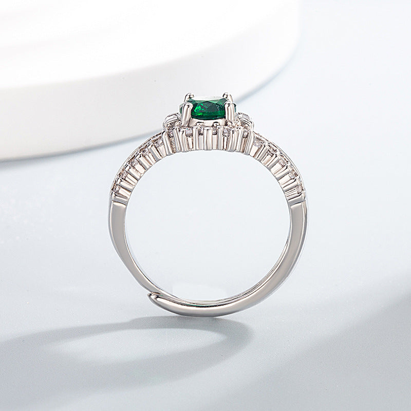 Oval simulierte Edelstein Halo-Verlobungsring mit Mikro Pavé Zirkonia und Baguette-Akzenten