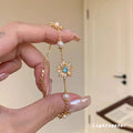 Filigranes Perlen- und Blumenarmband mit Zirkonia-mittelstein