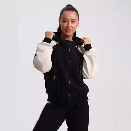 Damen sportlicher Kapuzen-Trainingsanzug aus Baumwollmix mit durchgehendem Reißverschluss und Kontrastärmeln Shop Nory