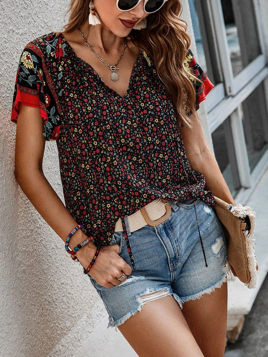 Damen Leichtes Blusenshirt mit V-Ausschnitt, kurzen Kimonoärmeln und floralem Allovermuster Shop Nory