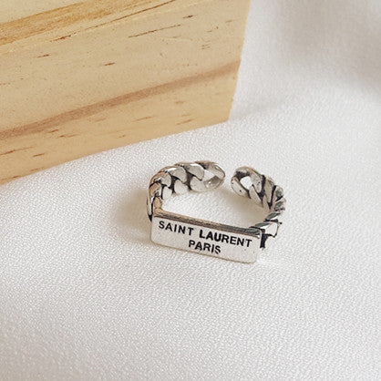 Damen Offener Ring mit geflochtenem Design und markantem Schriftzug Shop Nory