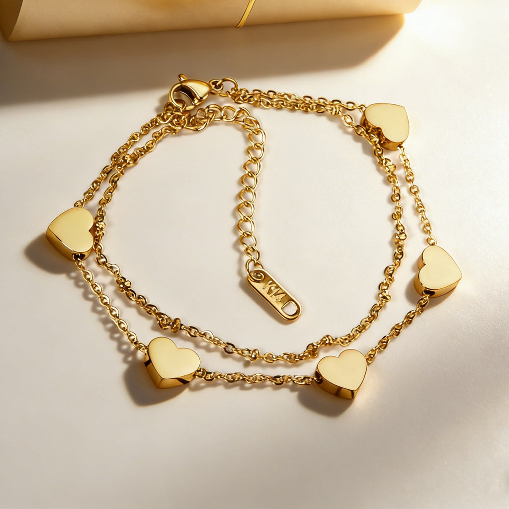 Damen Armband mit herzförmigen Anhängern aus hochwertigem Edelstahl und 14K Goldbeschichtung Shop Nory
