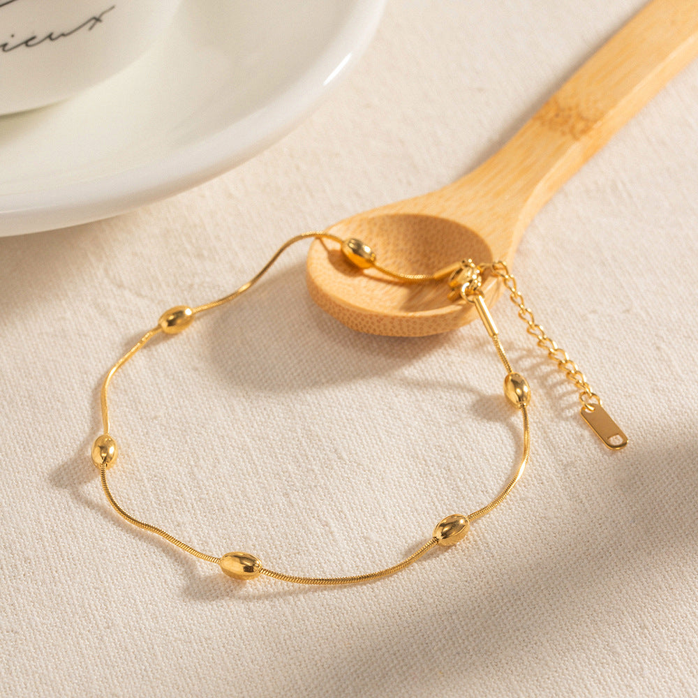 Damen Edelstahl-Armband mit goldfarbener Kugelverzierung und verstellbarem Verschluss Shop Nory