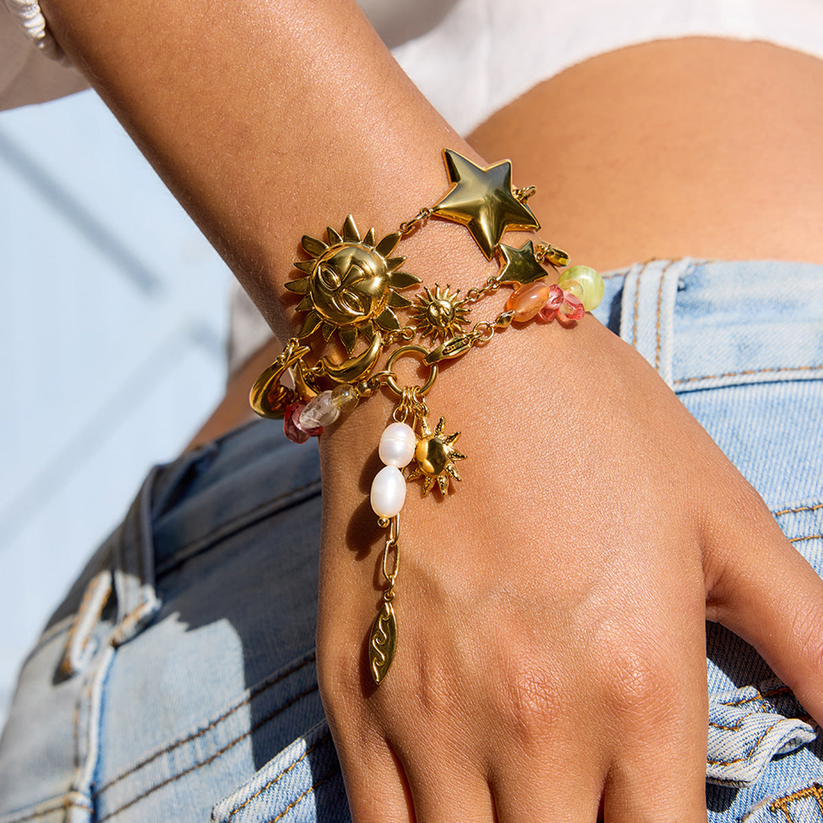 Damen Armband mit bunten Edelstein-Akzenten und goldfarbenem Sonnensymbol Shop Nory