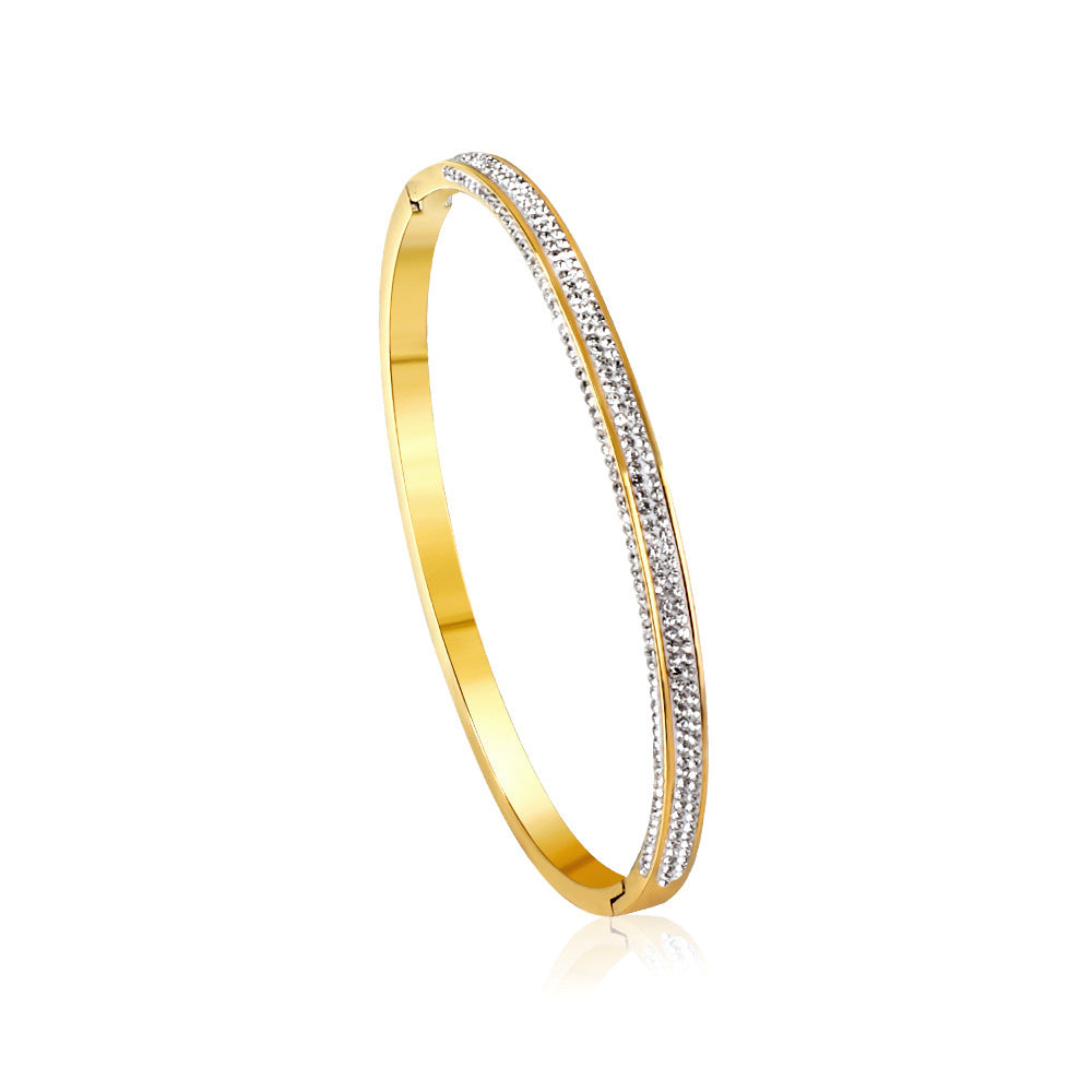 Damen Armreif mit funkelnden Zirkonia-Akzenten und elegantem Goldüberzug Shop Nory