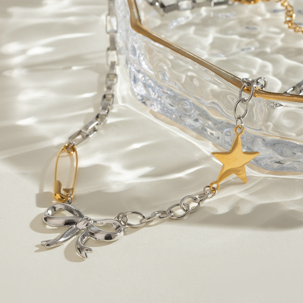 Damen Armband mit funkelndem Stern- und Schleifenmotiv aus hypoallergenem Edelstahl Shop Nory
