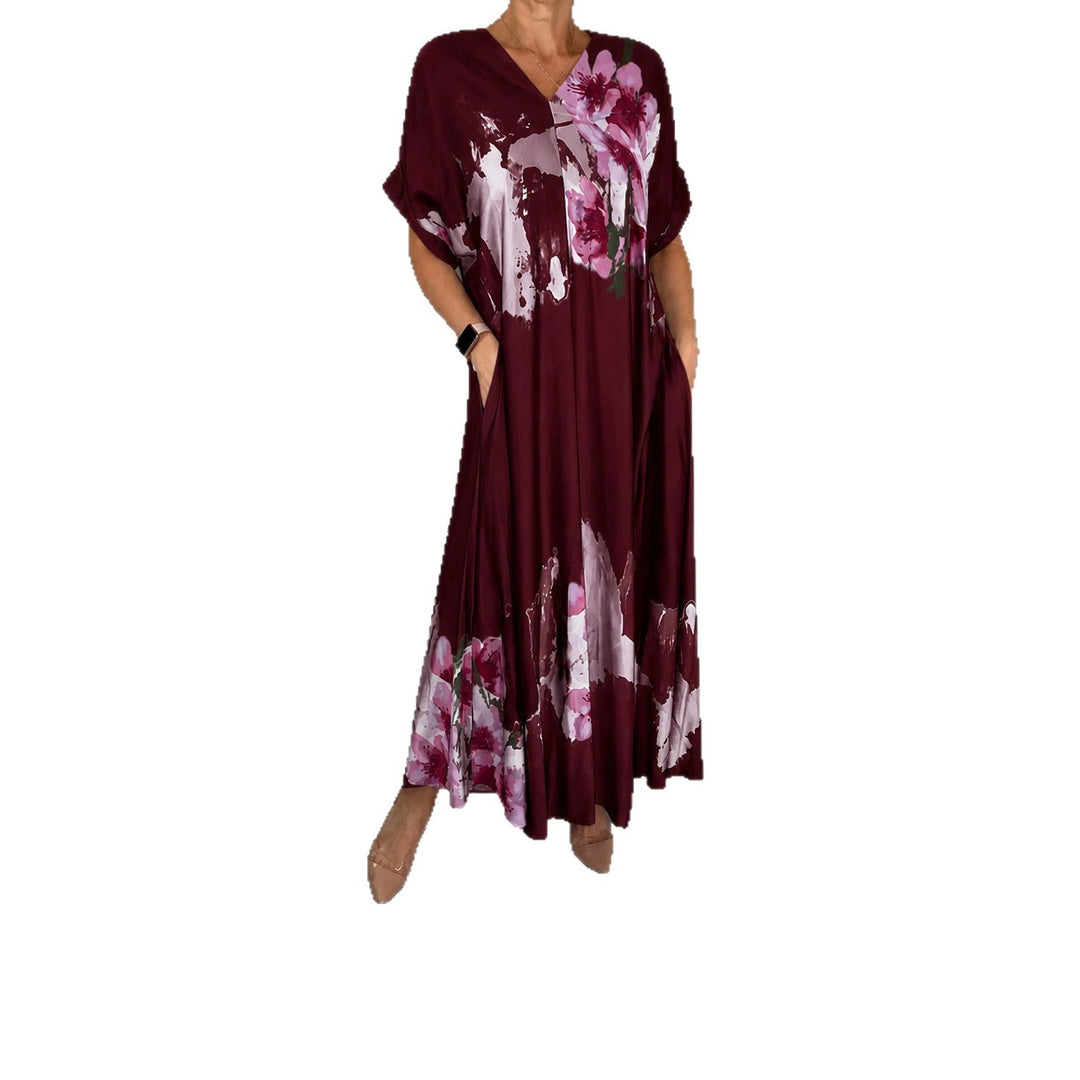 Damen Maxikleid mit weitem Fall, V-Ausschnitt, Eingrifftaschen und floraler Aquarelloptik Shop Nory