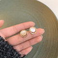 Damen Ohrstecker mit hochwertigem Muschelkern und elegantem Rahmen Shop Nory