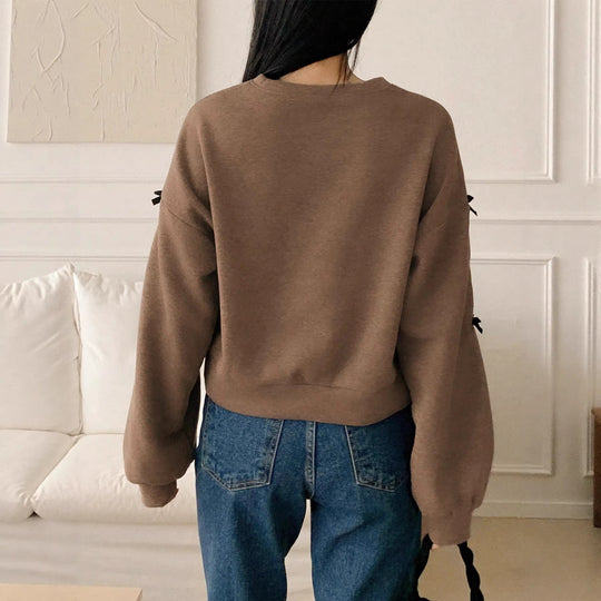 Damen Oversize‑Sweatshirt mit dekorativen Schleifenärmeln und Rundhalsausschnitt Shop Nory
