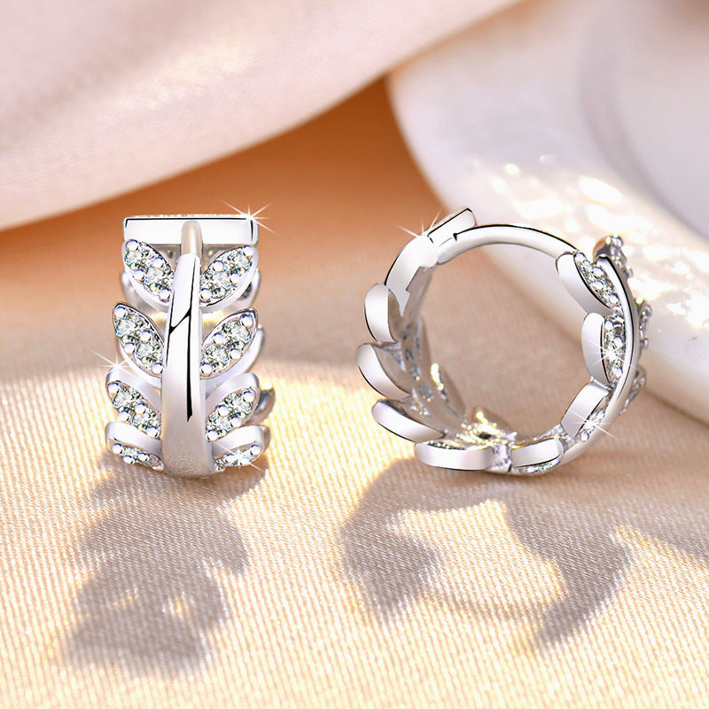 Damen Ohrringe mit floralem Blattdesign und funkelnden Zirkonia Shop Nory