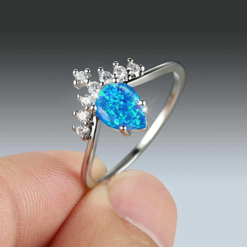 Damen Ring mit tropfenförmigem Opal und funkelnden Zirkonia-Elementen Shop Nory