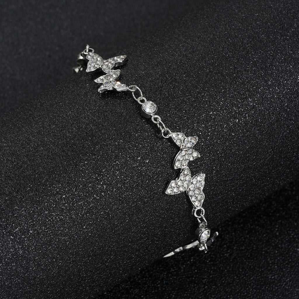 Damenarmband mit funkelnden Schmetterlingen Shop Nory