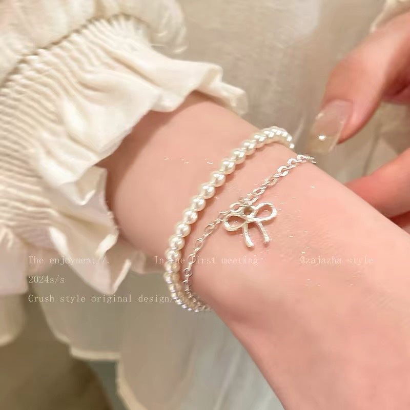 Damen Armbandset mit Perlen und charmantem Schleifenanhänger Shop Nory