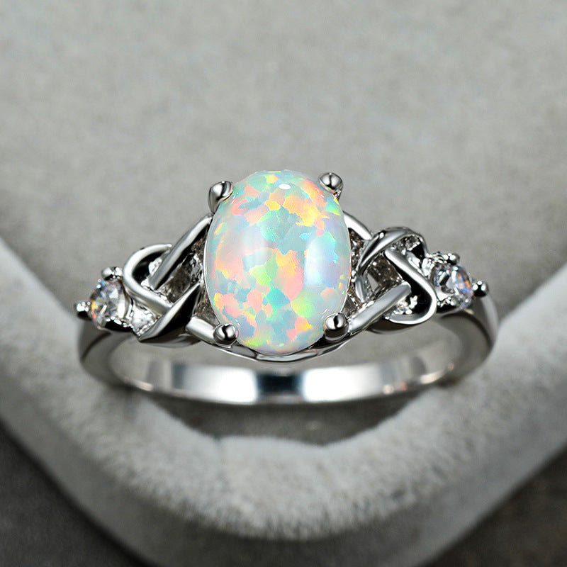 Damen Ring mit funkelndem Opalschmuck und kunstvollen Zirkonia-Details Shop Nory