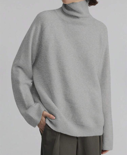 Damen Oversize Rollkragen-Feinstrickpullover mit Raglanärmeln und seitlichen Schlitzen Shop Nory