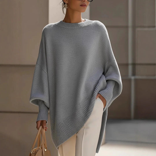 Damen nan Oversize Strickponcho mit asymmetrischem Saum und gerippten Ärmeln Shop Nory