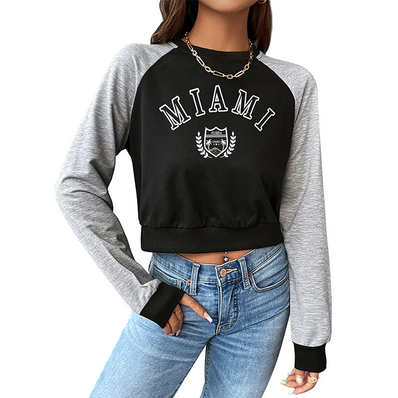 Damen Kurzgeschnittenes College-Cropped-Sweatshirt mit Raglanärmeln und elastischem Saum Shop Nory
