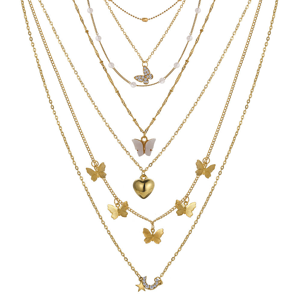 Damen Halskette Set aus feinen goldenen Ketten mit verspielten Anhängern Shop Nory
