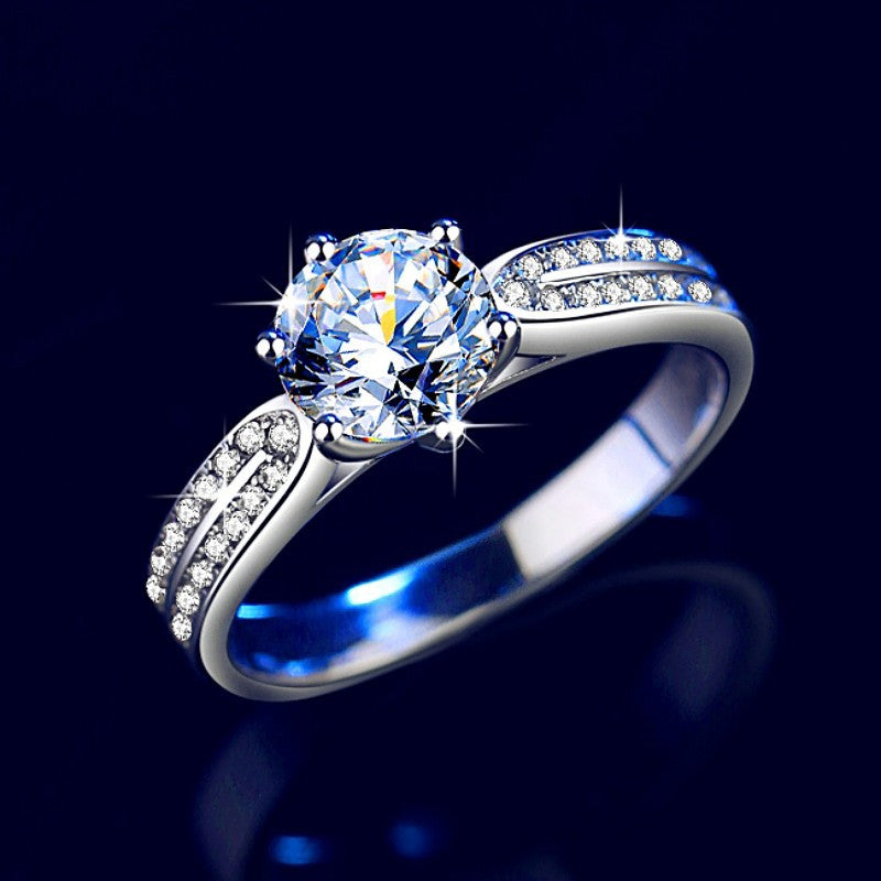 Damen Verlobungsring mit funkelndem runden Zirkonia und eleganter Fassung Shop Nory