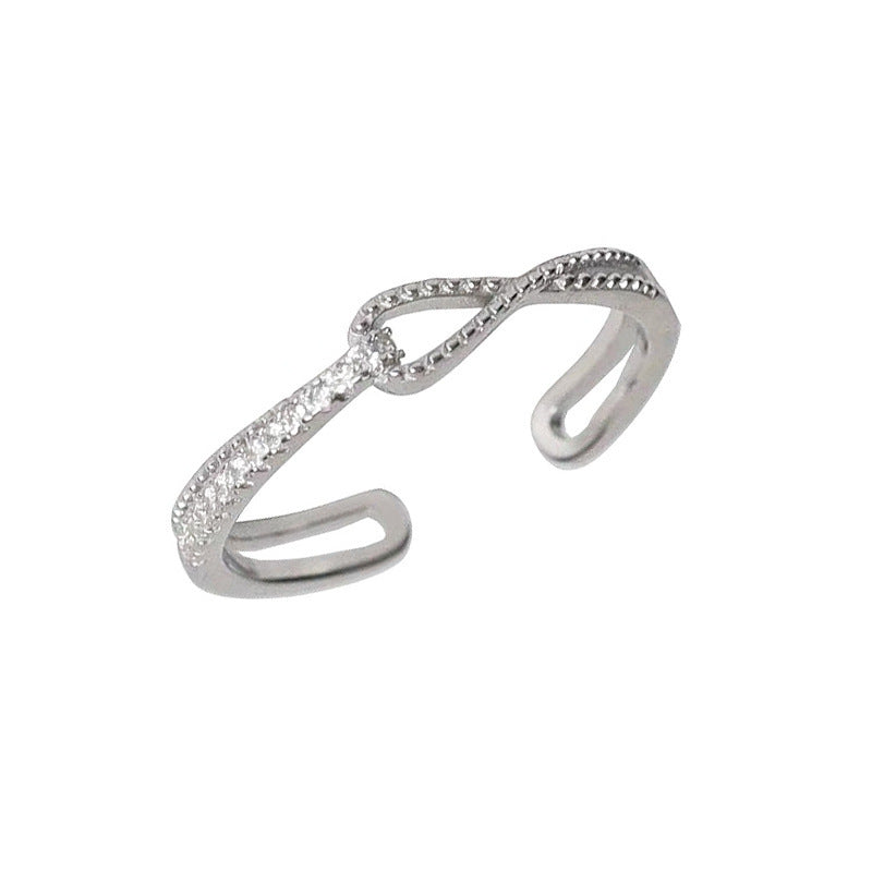 Damen Offener Armreif mit elegantem Infinity-Design und funkelnden Zirkonia Shop Nory