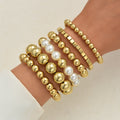 Damen Armreif-Set mit eleganten, glänzenden Kugeln und Perlen Shop Nory