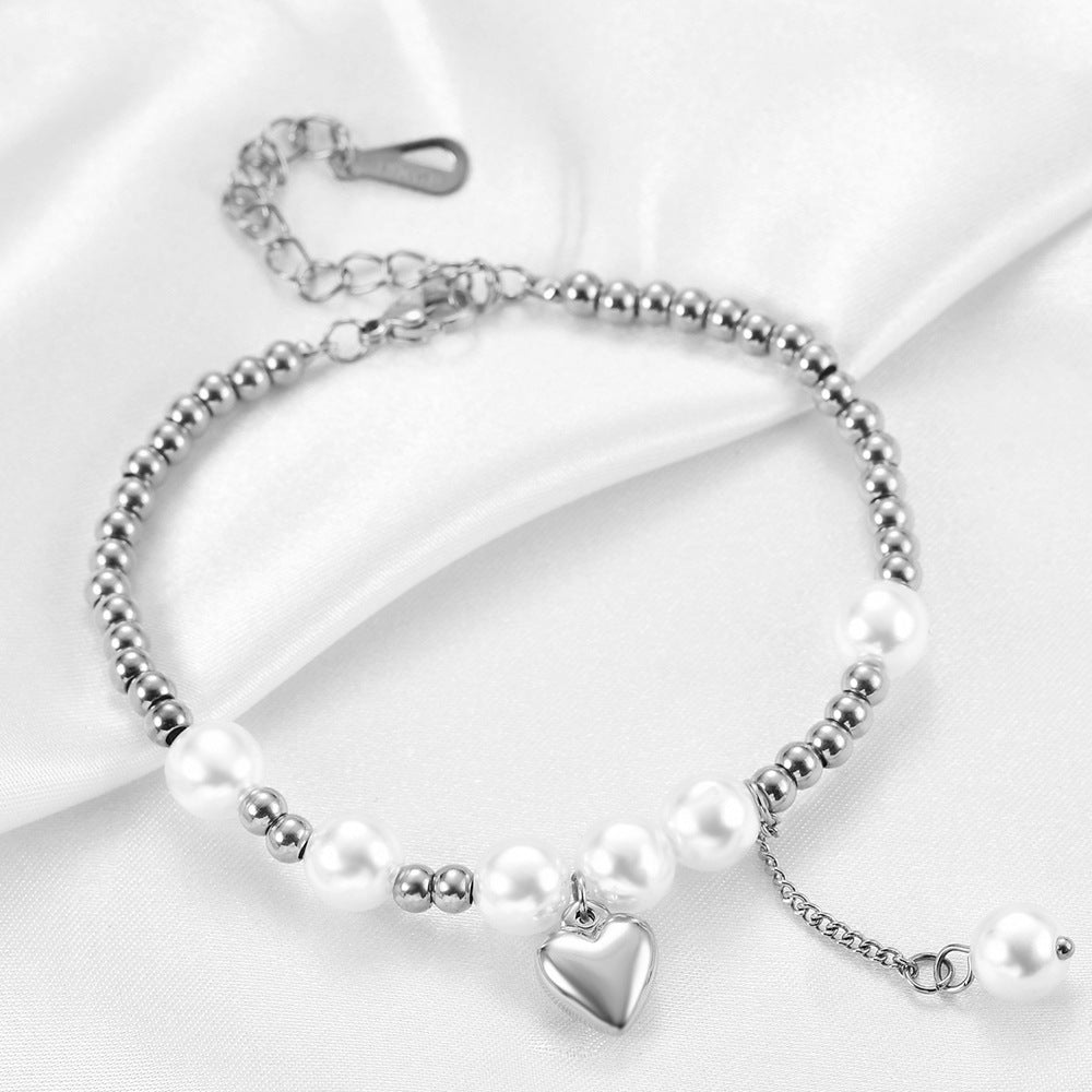 Damen Armband mit Herzanhänger und Perlenakzenten Shop Nory
