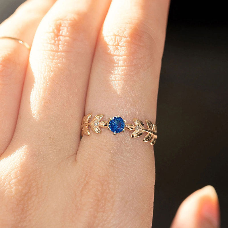 Damen Eleganter Verlobungsring mit blauem Stein und Blattdesign Shop Nory