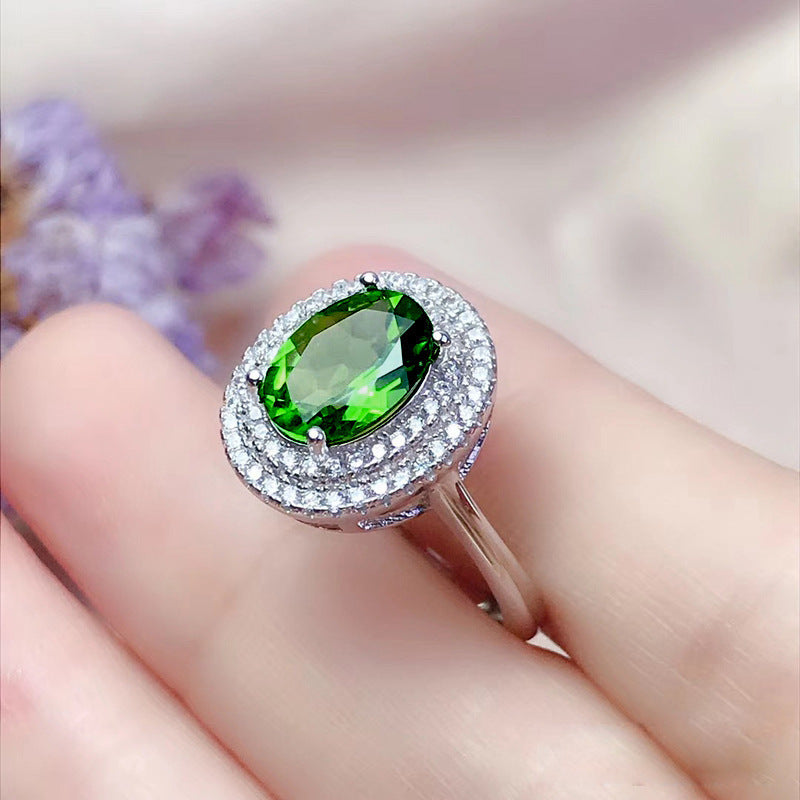 Damen Zierlicher Ring mit ovalem, strahlendem Edelstein und funkelndem Zirkonia-Besatz Shop Nory
