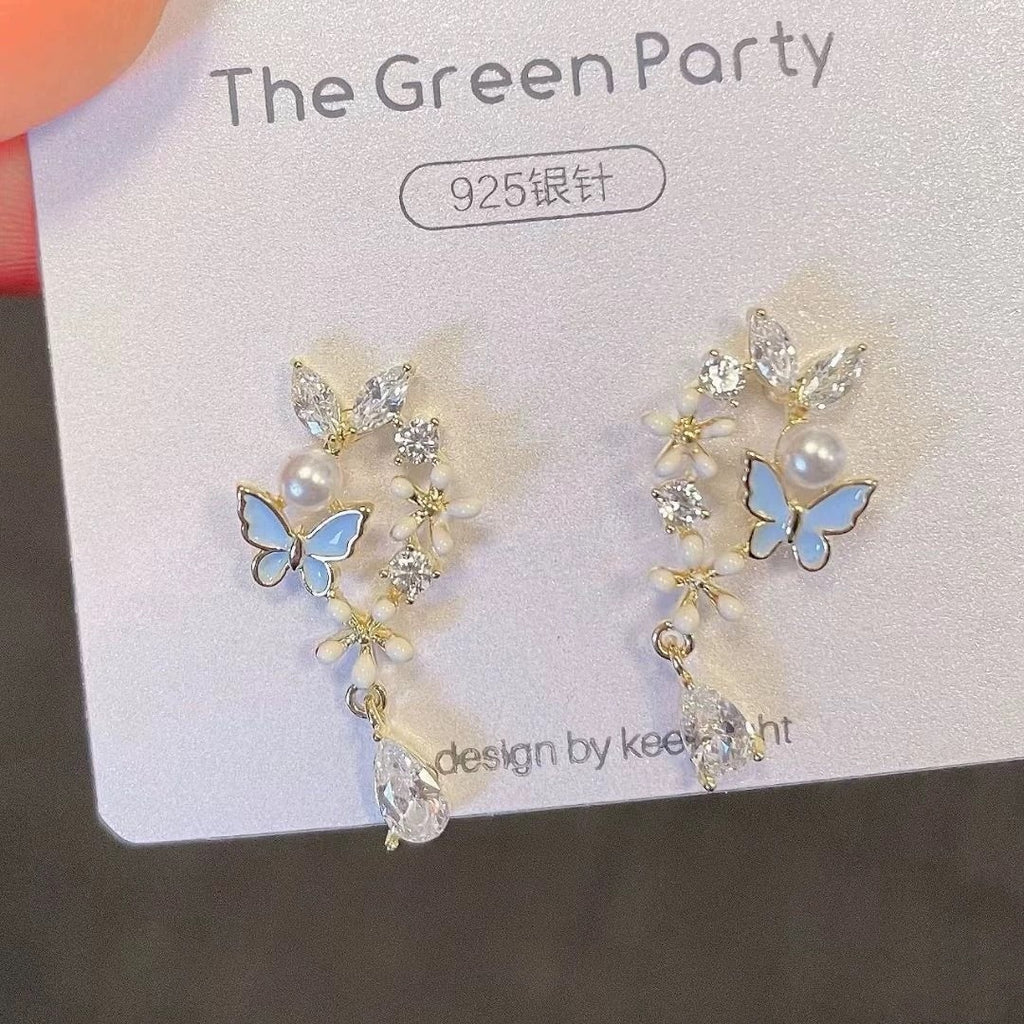 Damen Ohrstecker mit floralem Schmetterlingsdesign und funkelnden Akzenten Shop Nory