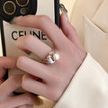 Damen eleganter Ring mit Perlen- und geschwungenem Akzent Shop Nory