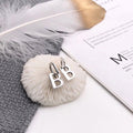 Damen Ohrhängende Buchstaben-Ohrringe Shop Nory