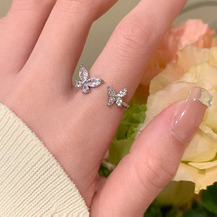 Damenring mit zweifachem Schmetterlingsdesign und funkelnden Zirkonia-Steinen Shop Nory