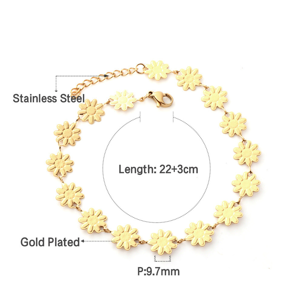 Damen Armband mit floralen Anhängern aus goldplattiertem Edelstahl Shop Nory