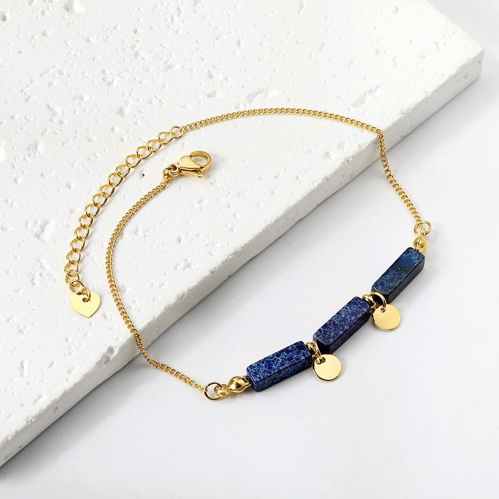 Damen Armband mit funkelnden Karibikstein-Elementen aus hochwertigem Edelstahl und goldplattierten Akzenten Shop Nory