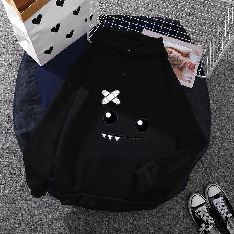 Damen nan Kapuzenpullover mit verspieltem Monstergesicht, Bandagen-Applikation und Kängurutasche Shop Nory