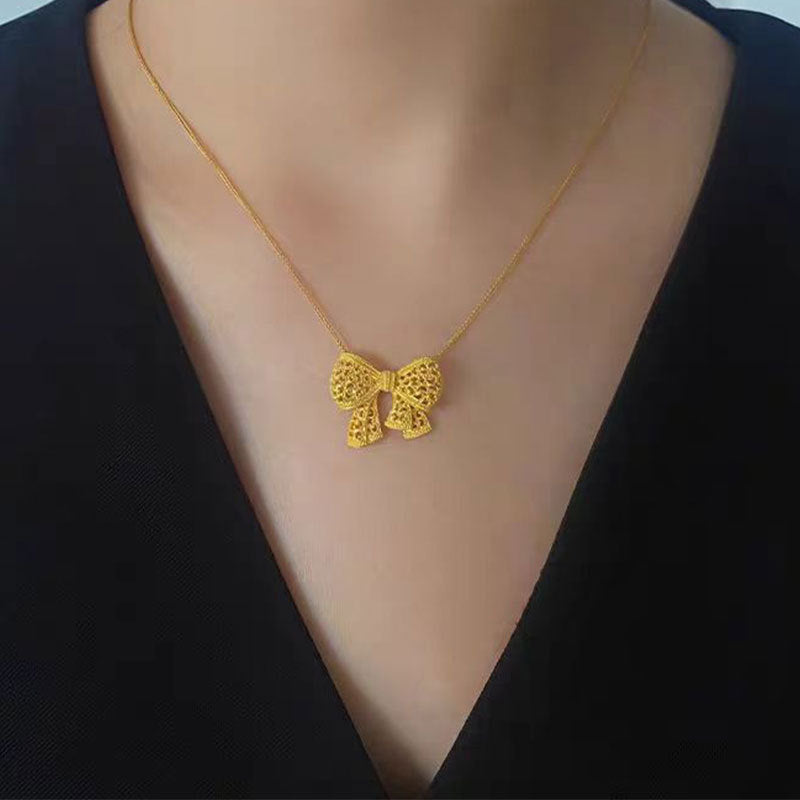 Damen Halskette mit kunstvollem Schleifenanhänger Shop Nory