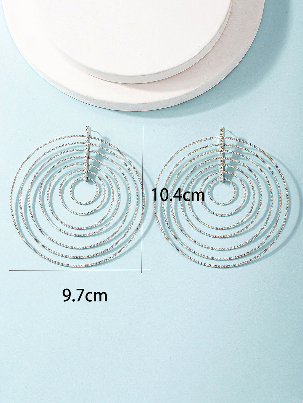 Damen Ohrringe mit geschichteten, kreisförmigen Designelementen Shop Nory