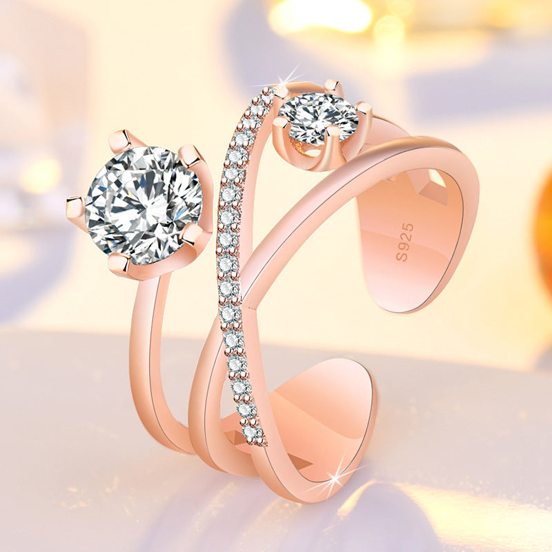 Damen Ring mit funkelnden Zirkonia und elegantem Kreuzdesign Shop Nory