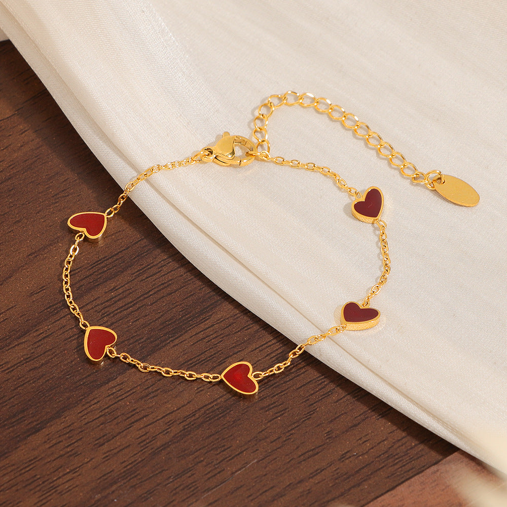 Damen Armband mit herzförmigen Anhängern Shop Nory