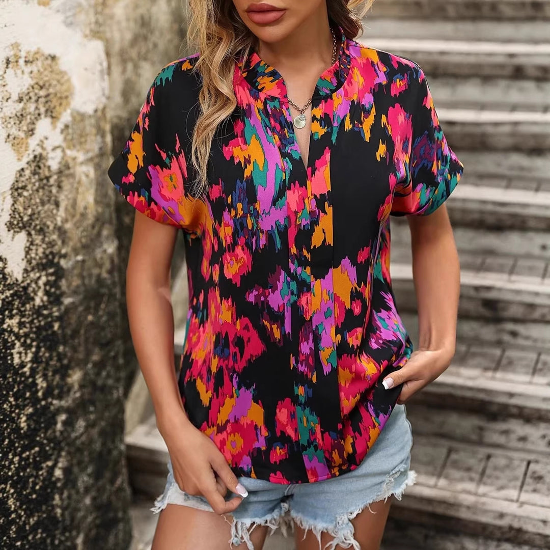 Damen Leichte Oversize Tunika‑Bluse mit Stehkragen, Cap‑Ärmeln und großem Blumenprint Shop Nory