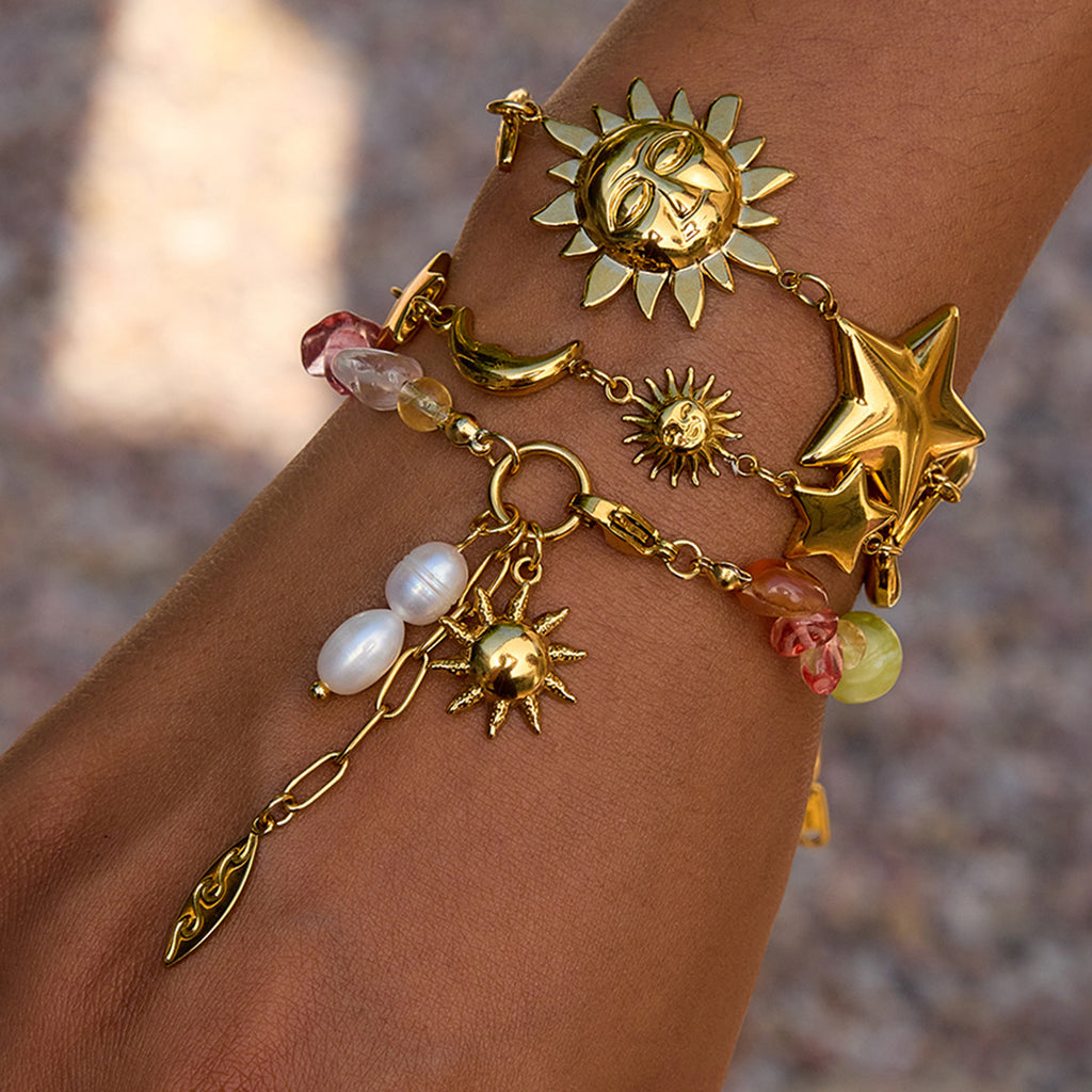 Damen Armband mit bunten Edelstein-Akzenten und goldfarbenem Sonnensymbol Shop Nory