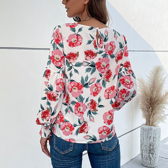 Damen Leichte Bluse mit großflächigem Blumenprint, Volumenärmeln und Smokbündchen Shop Nory