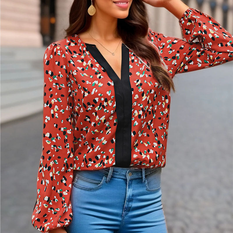Damen Locker geschnittene V-Ausschnitt-Bluse mit kontrastierter Zierblende und Allover-Print Shop Nory