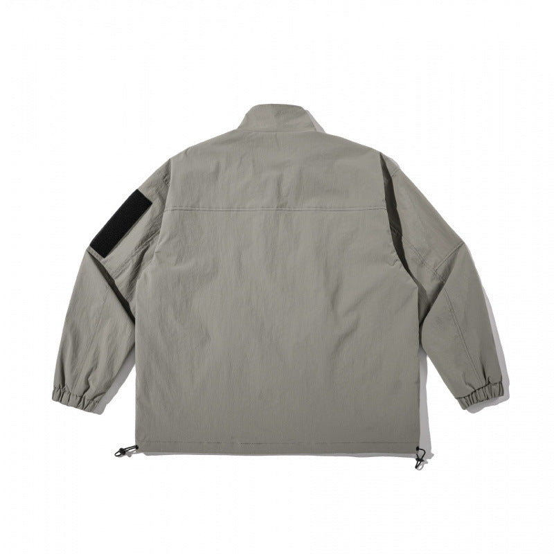 Unisex Leichte Technical-Utility Jacke mit Stehkragen, Reißverschlusstaschen und Kordelzugsaum Shop Nory