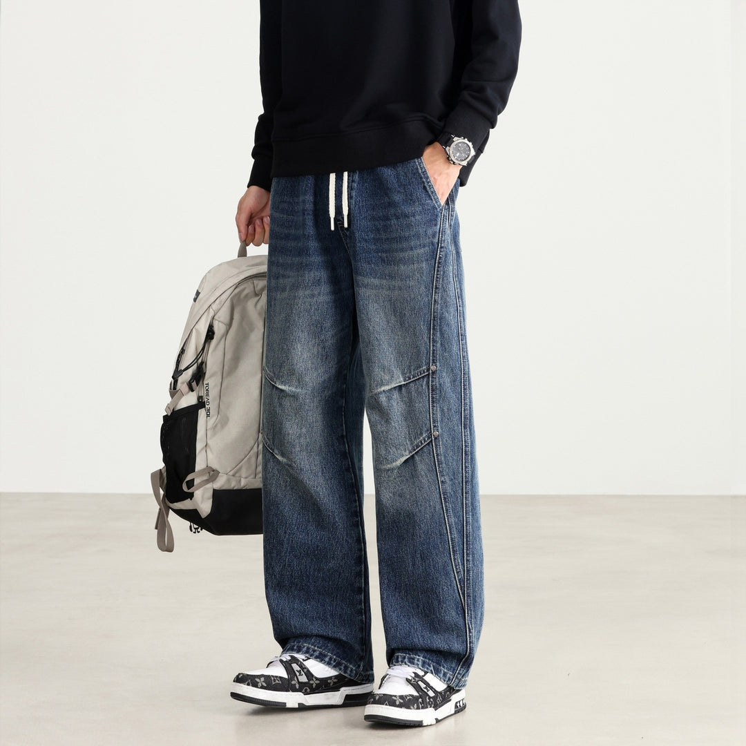 Herren Weite Denim-Hose mit Tunnelzugbund, Paneelnähten und Used-Waschung Shop Nory
